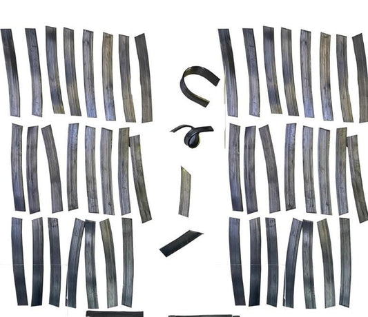 A collection of black metal strips, some are straight and some are curved. The strips are arranged in two groups, one on the left and one on the right. The strips are all the same size and shape. they are used as weights to keep live aquatic plants from floating up.