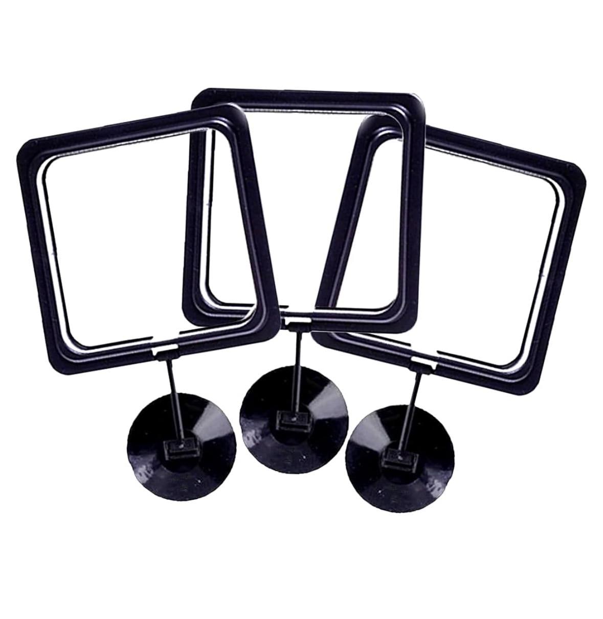 May include: Three black, square fish food rings