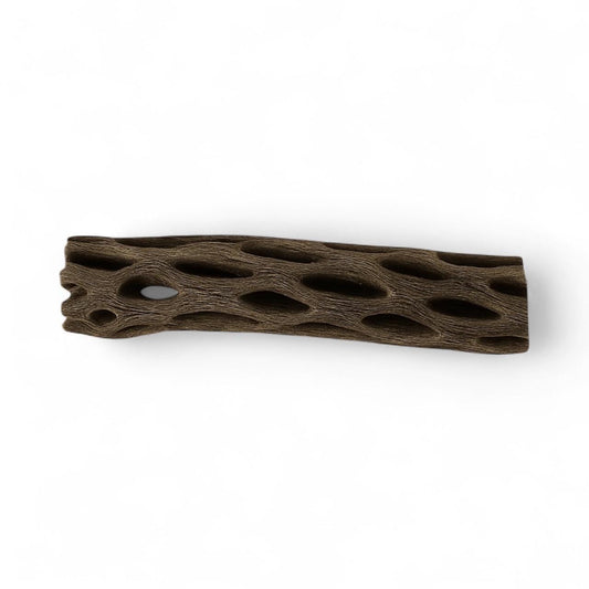 Close-up of a dried cholla wood piece with natural oval holes and a textured brown surface, commonly used as aquarium decor, shrimp or isopod hide, and natural hardscape element.