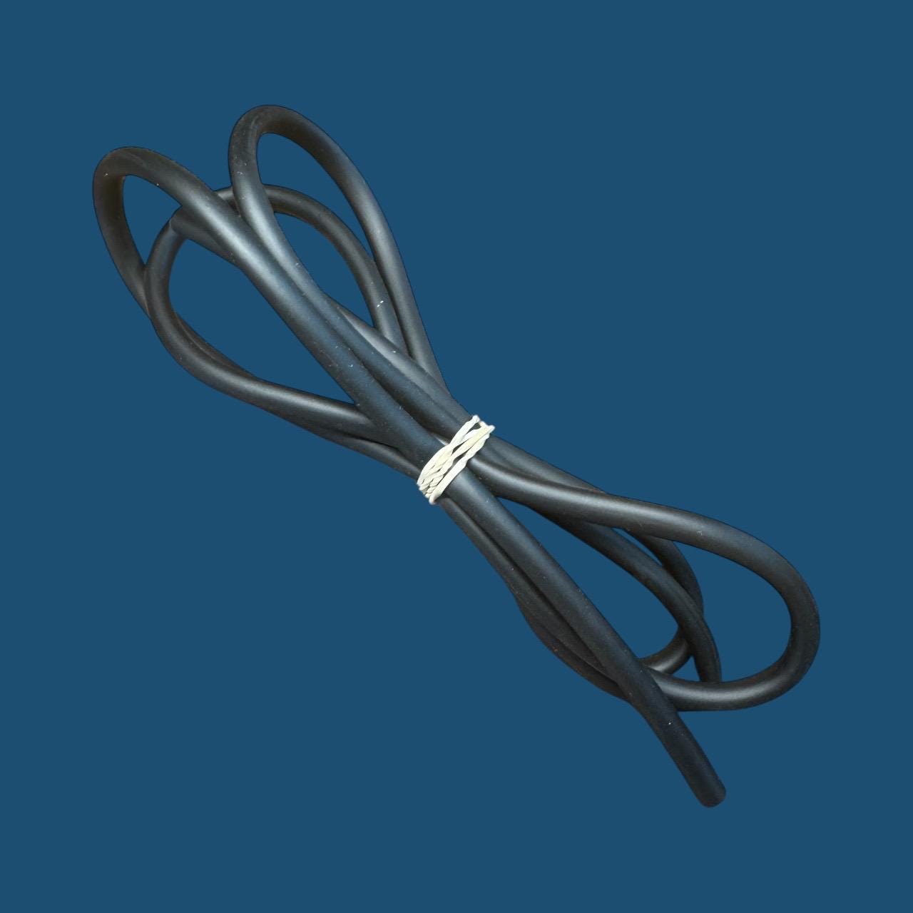 Coiled black silicone aquarium airline tubing secured with a twist tie, displayed on an ocean blue background — flexible air hose used for connecting air pumps, sponge filters, and bubblers in freshwater or planted aquariums.