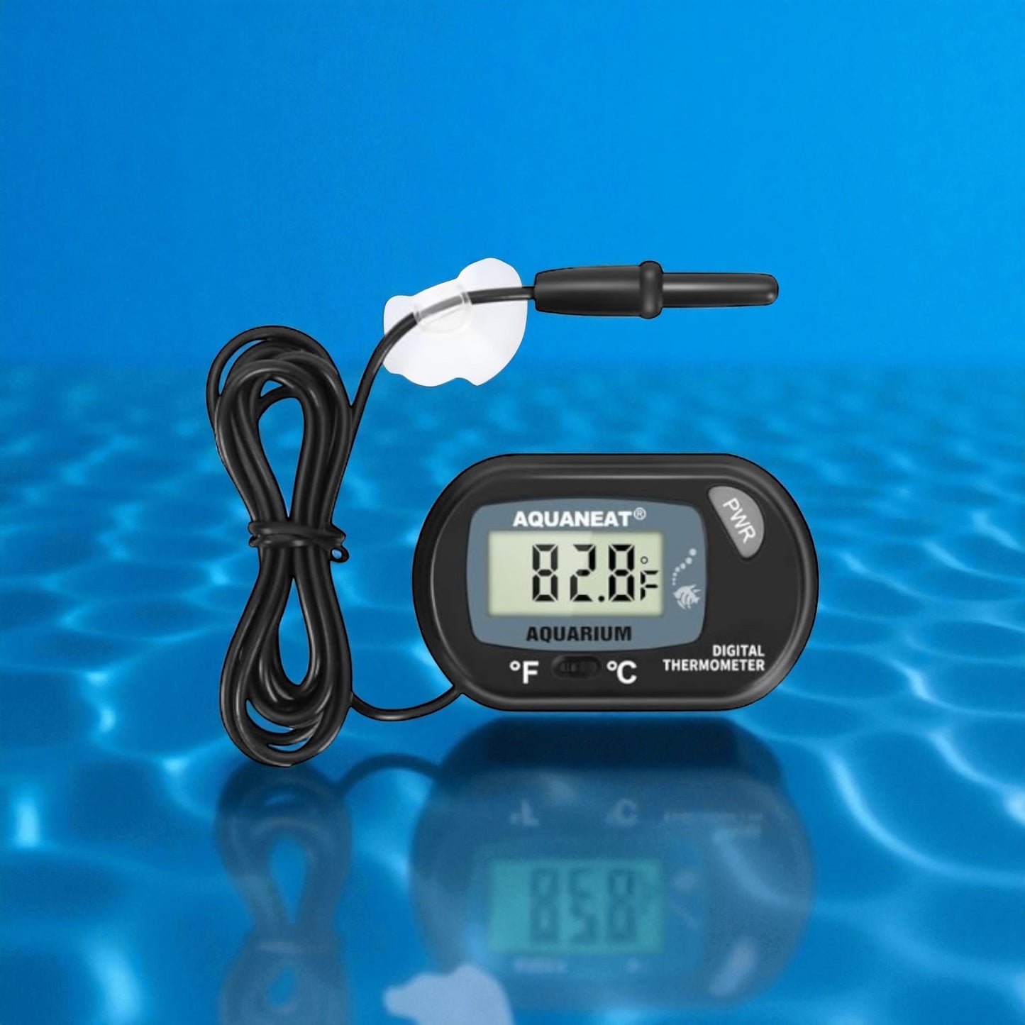 Aquaneat digital aquarium thermometer displayed against a bright blue water background with rippling reflections. The black thermometer shows a temperature reading of 82.8°F on its clear LCD screen. A wired temperature probe with a suction cup is attached for easy placement inside the tank, and the unit includes buttons to switch between Fahrenheit and Celsius.