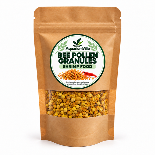 A stand-up kraft paper pouch of AquariumVille Bee Pollen Granules Shrimp Food, featuring a clear window showing the yellow and orange granules inside, on a white background.