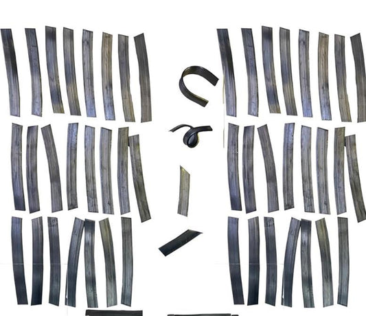 May include: A collection of black metal strips, some are straight and some are curved. The strips are arranged in two groups, one on the left and one on the right. The strips are all the same size and shape. they are used as weights to keep live aquatic plants from floating up.