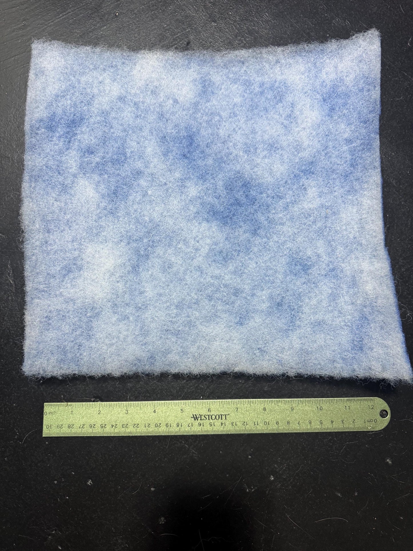 back side of 12x12 filter pad with ruler showing measurements