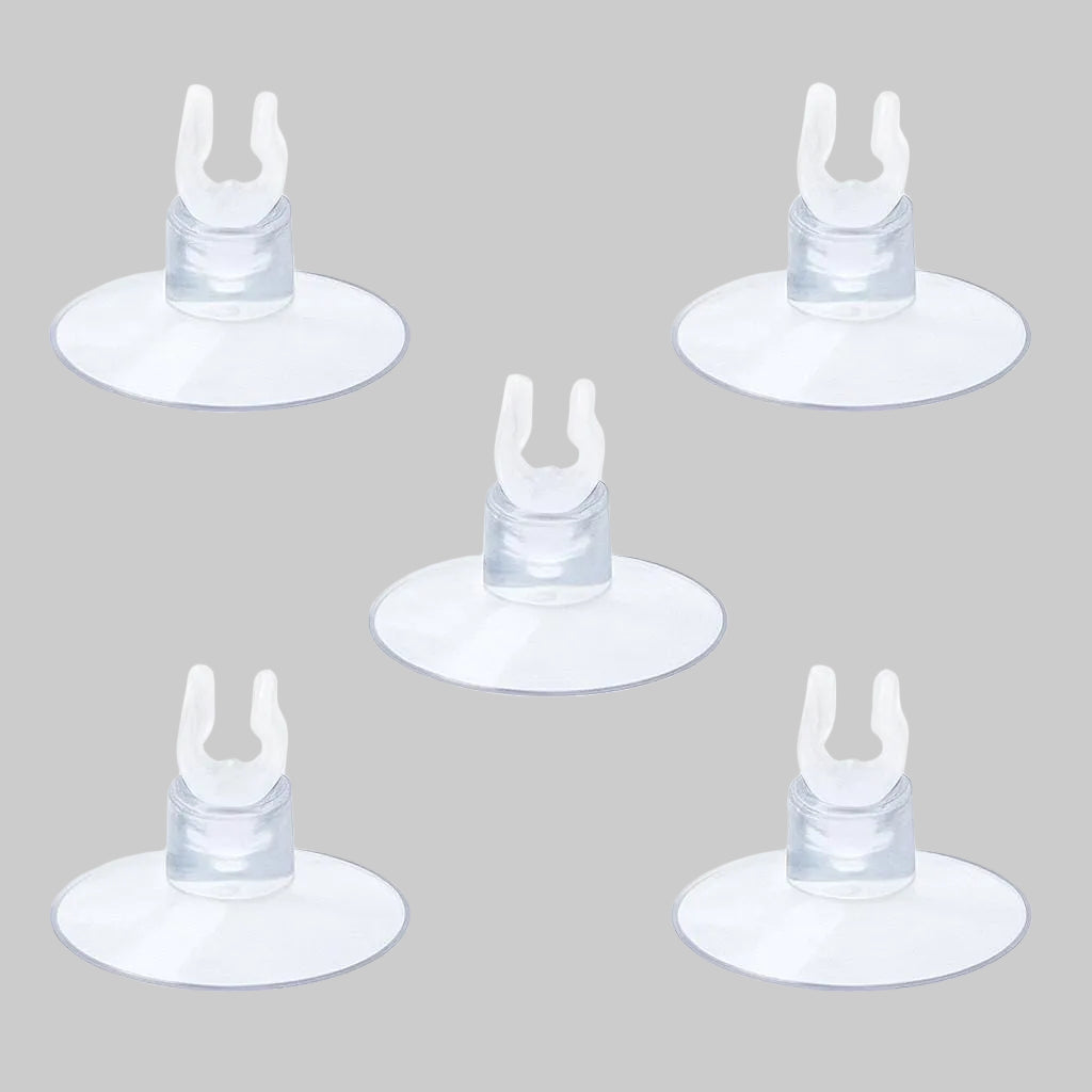 “Five clear aquarium suction cup clips evenly arranged on a white background, used to hold airline tubing securely inside fish tanks for air stones or sponge filters.