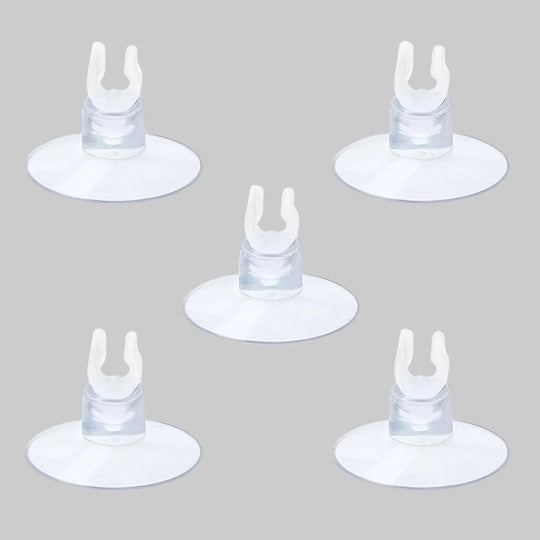 “Five clear aquarium suction cup clips evenly arranged on a white background, used to hold airline tubing securely inside fish tanks for air stones or sponge filters.