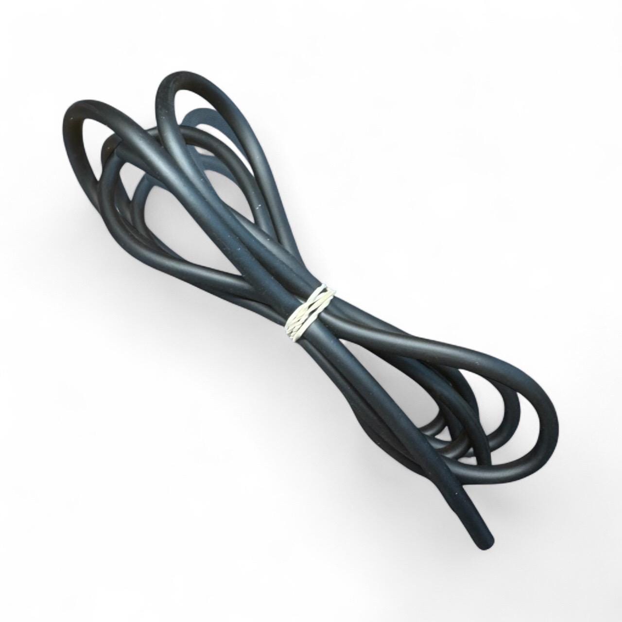 Close-up of coiled black aquarium airline tubing secured with a small twist tie, used for connecting air pumps, airstones, and filters in freshwater and saltwater aquariums.